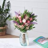ramo de flores lilas y rosas preservadas